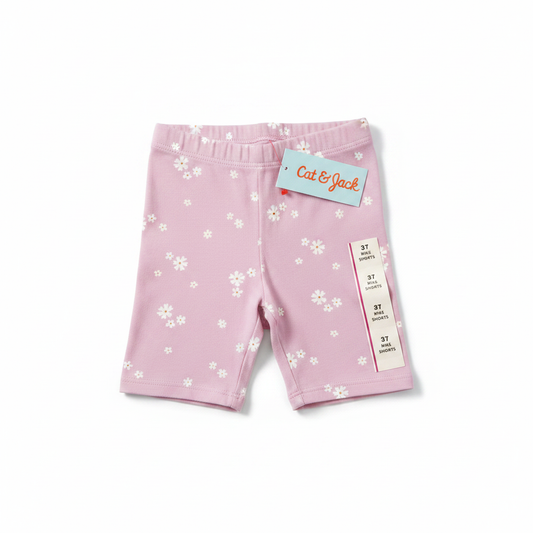Cat & Jack pink floral bike shorts flat lay on white background