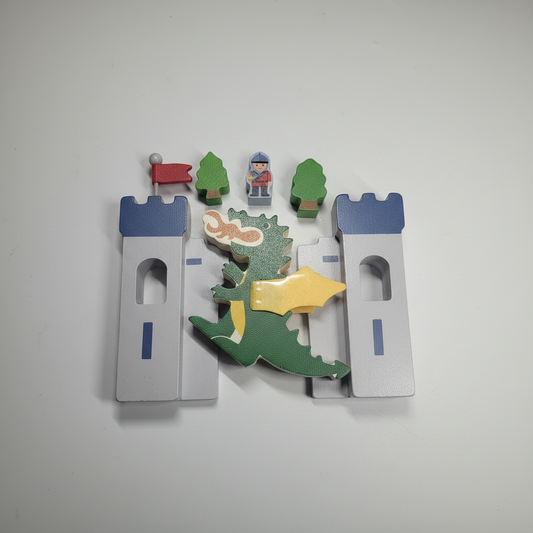 Wooden dragon and castle toy set on white background